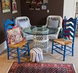 Pair of Wicker chairs with cushions, Wicker table with glass top 44" round, pair of blue ladder back chairs. 