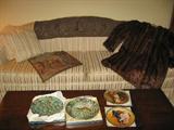 Tapestries, Limoges Black Forest & Norman Rockwell collector plates, and vintage mink coat from Blumbergs