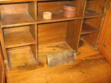 Inside of Post Office desk with clerk on duty sign