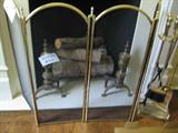 Brass fireplace screen, andirons, and tools