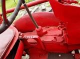 Farmall Garden Tractor – Runs Great! Includes 6 plow blades. 4 tine rake, chain driven fertilizer hopper with hose attachment, accessory bar for attachments, 6 extra attachment shanks, 2 discs hillers and middle buster, clamps, extra sweeps, extra hiller, 3 point hitch, belt drive attachment, tow bar