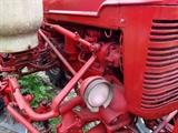 Farmall Garden Tractor – Runs Great! Includes 6 plow blades. 4 tine rake, chain driven fertilizer hopper with hose attachment, accessory bar for attachments, 6 extra attachment shanks, 2 discs hillers and middle buster, clamps, extra sweeps, extra hiller, 3 point hitch, belt drive attachment, tow bar