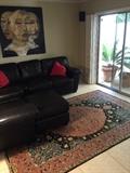Leather sofa ottoman on gorgeous rug