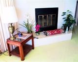 Glass topped end table with brass lamp