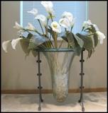 gorgeous calla lilies in glass and metal vase