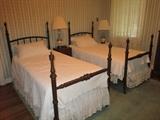Antique iron twin beds, vintage lamps, antique commode