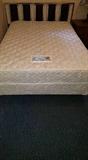 Full size mattress and box spring. Metal head board that can be made into a queen size. Perfect Sleeper.