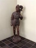 A cast figure with a fine patina in the form of "Bois Guilbert" a Knights Templar from the tale of Ivanhoe. The figure is depicted in full armor with a detachable lance on a circular base - 42" high