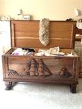 Second image of carved chest with some of the trousseau items