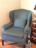 Upholstered wing-back armchair