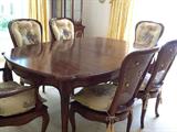 Dinning table with 6 chairs (cane backed, 4 side and 2 arm chairs) with custom pads for chairs and two leaves for tables with custom table pads for full length