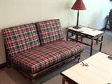 Mid-century rattan couch and tile-topped tables