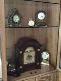 Chelsea (numbered piece) mantel clock (upper right corner), Howard Miller mantel clock (lower center)