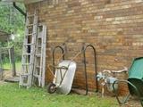 Outdoors - ladders, wheel barrow, metal chair