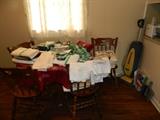 Round table & 4 chairs, Oreck Vacuum, Tablecloths, table runners, napkins, & place mats. 