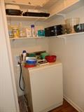 Washer, additional cleaning supplies, Tupperware, etc
