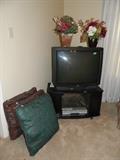 Pillows, TV, TV stand, flowers