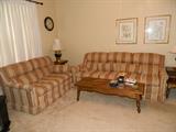 Matching love seat & sofa, 2 end tables & coffee table, lamps
