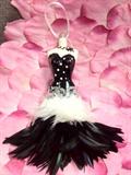 whimsical handcrafted ceramic & feather "ornament"