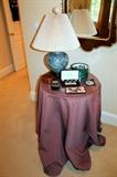 Asian lamp and glass-top table with cover
