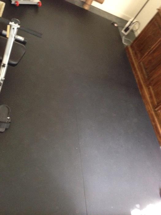  Four large rubber mats for garage or exercise room