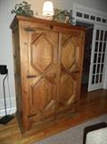 Distressed mixed wood entertainment armoire