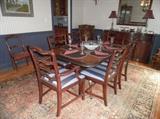 Vintage mahogany dining room: Duncan Phyfe style table with brass capped feet; ribbon backed chairs (two armchairs, four side chairs) w/upholstered seats; oriental style (old) carpet