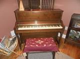 upright piano and stool