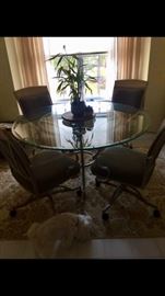 Wonderful Glass Top Dining Table with 4 Swivel Chairs 