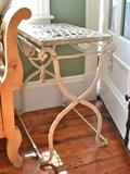 Iron table with lattice top and rope and tassel decoration (1/2)