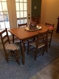 Vintage Solid wood table with Primitive style rush seat chairs.   Vintage Mexican Tourist Pottery Bean Pot