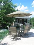 Table, chairs, umbrella