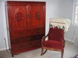 Oriental designed dresser with doors on top, red velvet covered rocker
