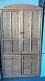 Large Entertainment Center with closing doors. Can also be used as storage as these doors close up. There are two matching end pieces if you prefer larger unit