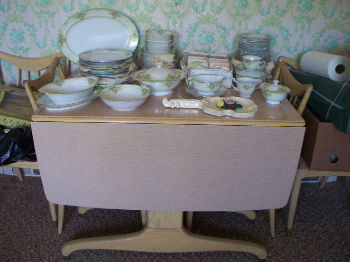 Diningroom table and chairs and a very nice set of china