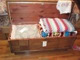 LANE CEDAR CHEST FULL OF THROWS AND BLANKETS.