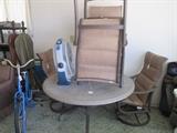 Patio table with 4 chairs - 2 are swivel/rockers