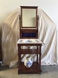 Circa 1850s Mahogany Dry Sink Stand, China Sink and Pitcher. All originial pieces. Mirror has some aging. bottom shelf has a crack and pitcher has been repaired. Sink and overall stand in very good antique condition. Bottom of sink and pitcher have the Keele Crest and Cauldon England mark.
