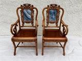 Pair of 19th-century Chinese hand-carved wood and marble chairs. These chairs were used in temples and esteemed official homes as welcoming chairs; where a guest would sit and wait for his host to welcome him into the home.