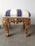 Rococo-style stool with gilt finish to the legs and navy-and-cream fabric.