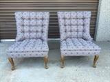 This pair of square, button-stitched slipper chairs have been freshly reupholstered in a geometric gray, raspberry, and white, heavy cotton. The legs have been left with their fabulous vintage patina.