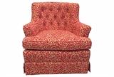 Petite 1950s swivel chair reupholstered in raspberry red and tan linen-cotton blend batik-style fabric. Swivels a complete 360 degrees on a four pronged metal swivel. Original maker's mark reapplied to new seat bottom. 