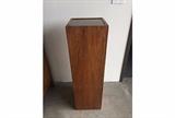 Mid-century Brown Saltman Display Pedestal. Made with reclaimed wood with smoked glass, removable top and lower cord slot to accommodate interior uplight (not included). Maker's mark on interior of pedestal. A fun and rare find!