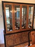 The lighted China cabinet is a beautiful piece of furniture. Glass shelves mirrored back.