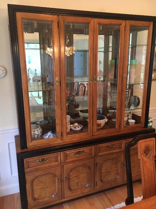 The lighted China cabinet is a beautiful piece of furniture. Glass shelves mirrored back.