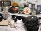 Kitchen full of small appliances, bakeware, pots & pans