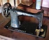 Old SINGER machine in cabinet