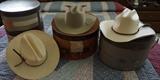 Cowboy hats. The middle is a Stetson 3x Beaver hat