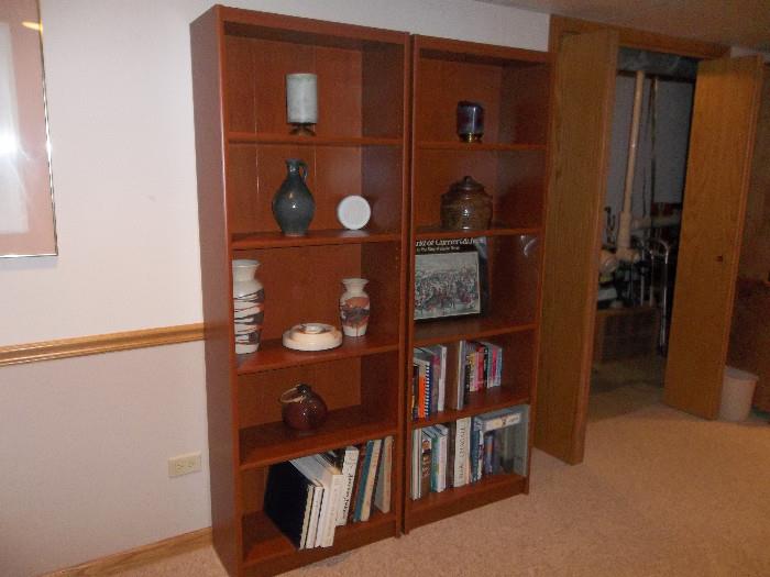 Book shelves, books, and pottery
