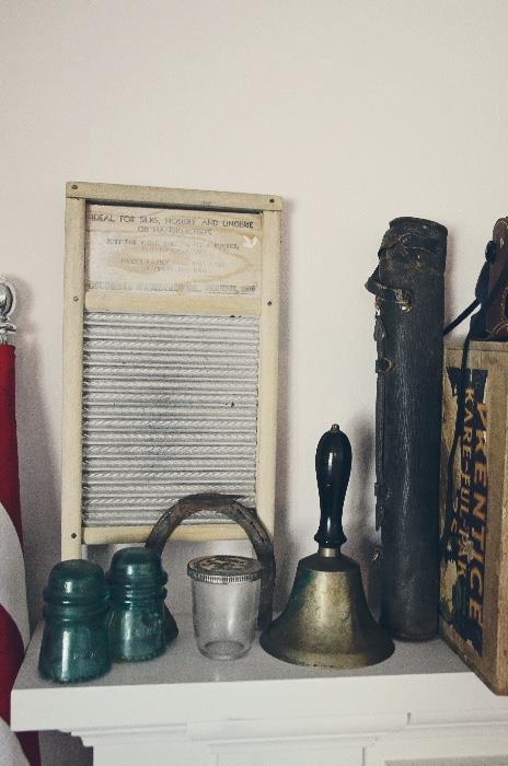 Washboard, glass insulator, horseshoe, school bell